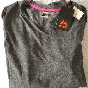Reebok long sleeve moisture wicking top. New with tags.